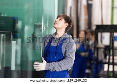 During work process, guy employee produces blanks for repairs and interior decoration. He carries out installation work, products for renovation of residential premises made of glass and plastic.