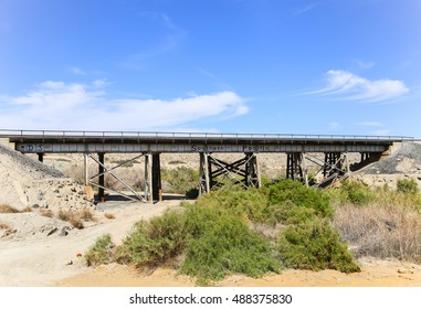 DURMID, CALIFORNIA, USA - MAY 26, 2015: Rail Bridge Next To California State Route 111 With The Logo Of The Former Railroad Company Southern Pacific.