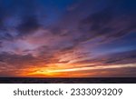 Dusk, Evening Sky Clouds on Twilight over Sea, Dramatic horizon Orange Sunset sea Summer sky Golden Hour on Landscape nature dark Blue Sky Background 