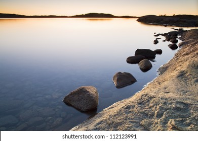 Dusk Over Rocky Shore