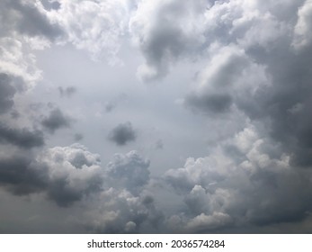 Dusk overcast sky. Gray cloudy curve shape against hazy sky. Cloudscape view background. 