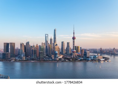 dusk scene in shanghai, beautiful pudong financial center and huangpu river in sunset, China.