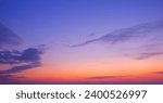 Dusk Sky Background in the Evening with Light Blue Purple SunSet  and Silhouette Streak Cloud on Colorful Orange Twilight sky, Idyllic Natural Tranquil Scene