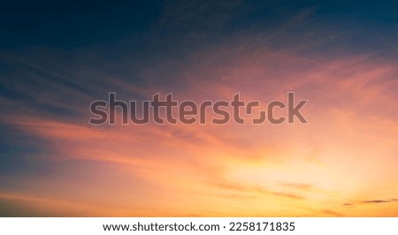 Dusk Sky on Twilight in the Evening with Orange Gold Sunset Cloud Nature Backgrounds , Horizon Golden Sky