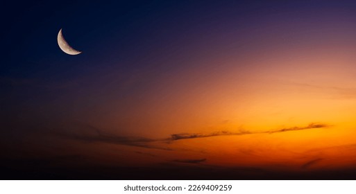 Dusk, Sky twilight in the Evening with sunset orange sunlight and Crescent moon free space for religion Islamic text Ramadan, Eid Al Adha, Eid Al Fitr, Eid Mubarak 