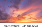 Dusk, Sunset Sky Clouds in the Evening with colorful Orange, Yellow, Pink and red sunlight and Dramatic storm clouds on twilight sky, Landscape horizon Golden sky nature Summer Background 