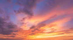 Dusk, Sunset Sky Clouds In The Evening With Colorful Orange, Yellow, Pink And Red Sunlight And Dramatic Storm Clouds On Twilight Sky, Landscape Horizon Golden Sky Nature Summer Background 