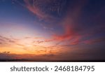 Dusk, Sunset sky clouds over sea in the evening on twilight with Blue, Purple, Pink and Orange sunlight, Horizon sea sky landscape backgrounds in Summer