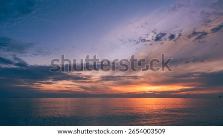 Dusk, Sunset sky clouds over sea in the evening on Dramatic twilight with Blue, Purple, Pink and Orange sunlight, Horizon sea sky sun dawn landscape cloud backgrounds in Summer