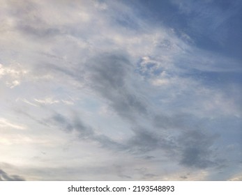 Dusky Cirrus Clouds Float Through The Earth's Surface