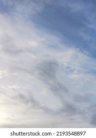 Dusky Cirrus Clouds Float Through The Earth's Surface