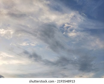 Dusky Cirrus Clouds Float Through The Earth's Surface