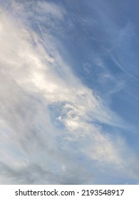 Dusky Cirrus Clouds Float Through The Earth's Surface