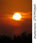 dusky view of the setting sun during sunset in the evening