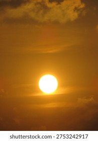 dusky view of the setting sun during sunset in the evening