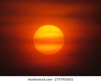 dusky view of the setting sun during sunset in the evening