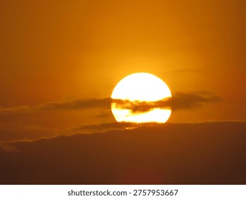 dusky view of the setting sun during sunset in the evening