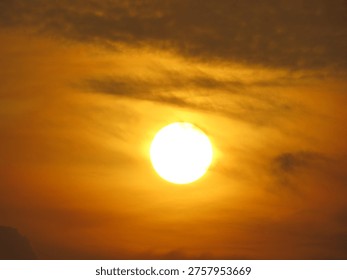dusky view of the setting sun during sunset in the evening