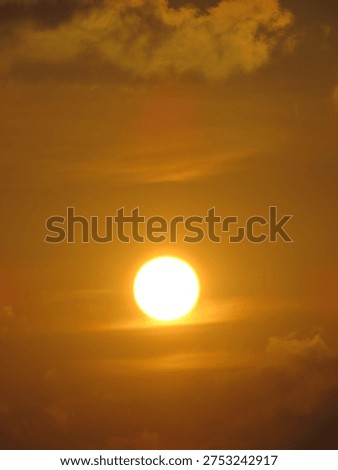 dusky view of the setting sun during sunset in the evening