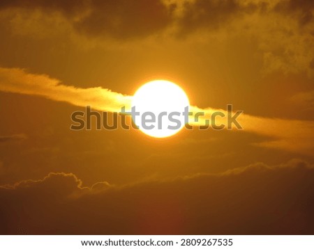Dusky view of the setting sun during sunset in the evening