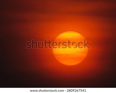 Dusky view of the setting sun during sunset in the evening
