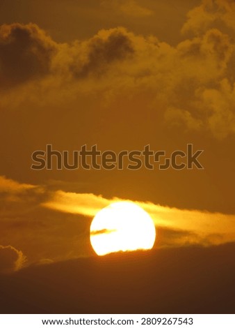 Dusky view of the setting sun during sunset in the evening