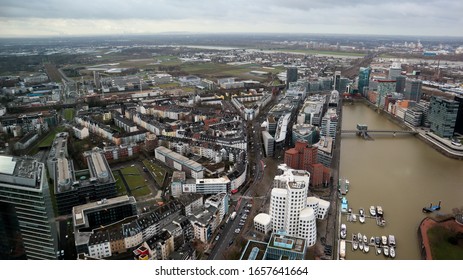 Dusseldorf, Germany - February 20, 2020. Scenic View Of The City Of Dusseldorf, The Embankment Of The River And The Rhine. Aerial View Of A European City In Germany. Aerial View Of A Drone. Panorama.