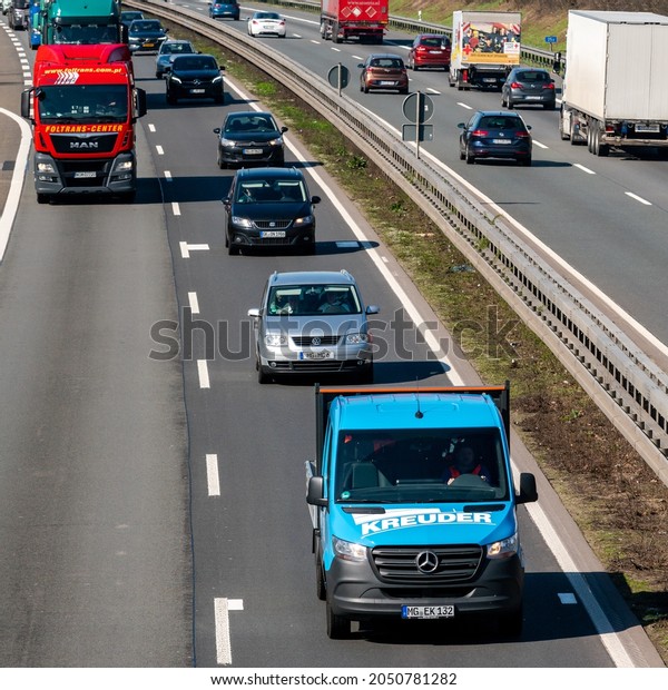 DUSSELDORF ,GERMANY - March  22, 2019: Highway\
transportation with cars and\
Trucks