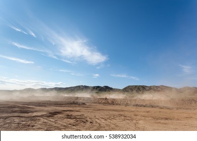 the dust was blowing in busy construction site against a blue sky - Shutterstock ID 538932034