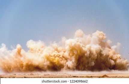 Dust clouds after dynamite blast on the mining site