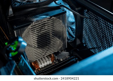 Dust inside of a broken computer. complication of the PC. fan and other computer boards in the dust.