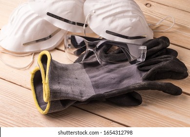 Dust masks, goggles and protective gloves. Personal protective equipment for workers
 - Powered by Shutterstock