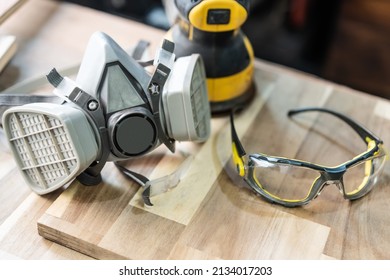 Dust Masks for Woodworking , Respirator Cartridge Filter , glasses on table .Work safety concept ,selective focus - Powered by Shutterstock