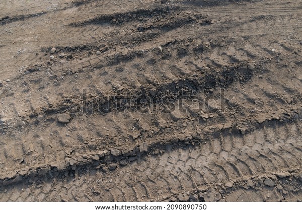 Dust mud dry soil earth dirt\
construction site field truck vehicle tyre tire tracks poured\
material