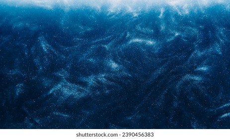 Dust particles background. Glitter swirls. Light shimmering shiny liquid sparks ink flow on dark blue abstract hypnotic mysterious space art. - Powered by Shutterstock