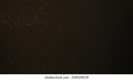 Dust Particles Float In Sunlight On Black Background, Wide Photo