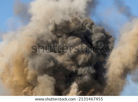 Dust and rock particle after detonator blast 
