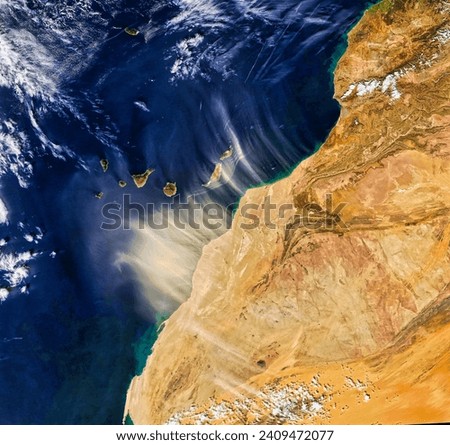 Dust Storm Engulfs Canary Islands. The event, known locally as la calima, turned skies orange and degraded air quality in Gran Canaria. Elements of this image furnished by NASA.
