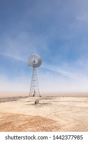 dust storm and lone windmill, wheat belt region, Western Australia
