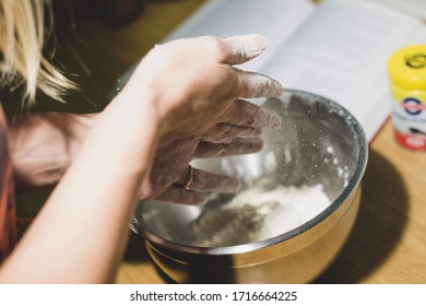 Dusting Off Hands After Butter Has Been Crumbled Into Flour