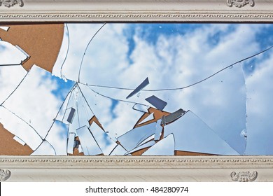 Dusty Broken Mirror In A Vintage White Frame, The Reflection Of Blue Sky And Clouds, Flat Lay
