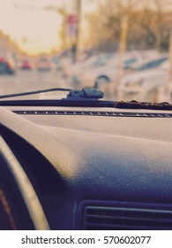 Dusty Car Dashboard With Blurred Traffic Background