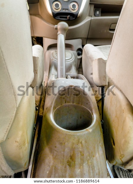 dusty and dirty an interior of a modern\
vehicle lots of irremovable stains on them\
