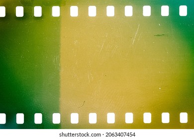 Dusty And Grungy 35mm Film Texture Or Surface. Perforated Camera Film Isolated On White Background.