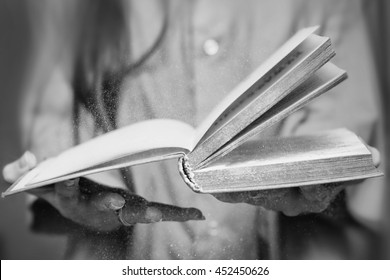 Dusty Old Book In Her Hands.