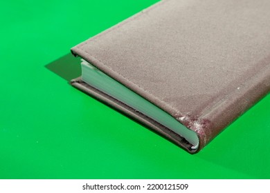 Dusty Old Notepad On Light Green Background