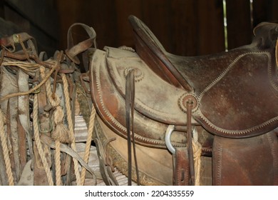 Dusty Old Saddle Kept In A Barn