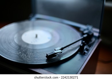 Dusty Old Vinyl Record on a Turntable - Shutterstock ID 2242130271