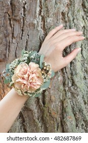 Dusty Pink Carnation Wrist Corsage On A Hand