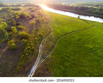 Dusty Roads Go In Different Directions On The Plateau Near The River